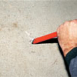 wiped to remove any loose material