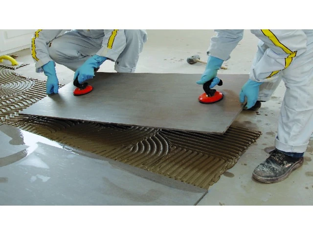using high performance tile adhesive